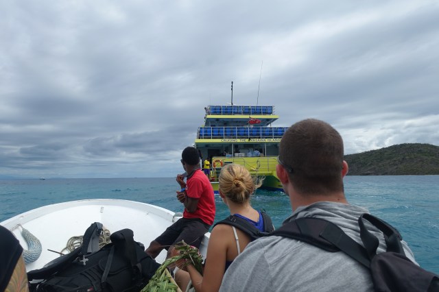 On the little boat, getting on the big boat to the mainland